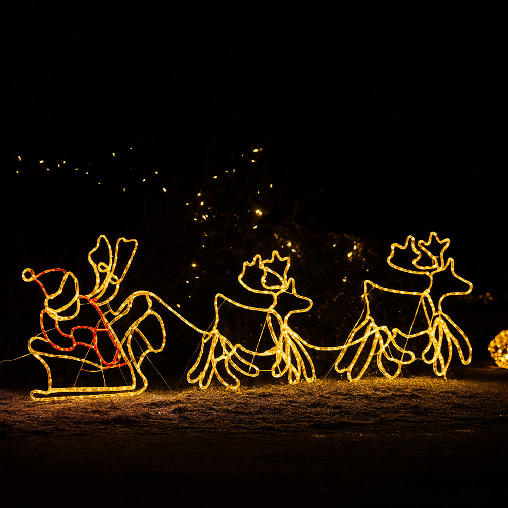 Julenissen, reinsdyr og slede - 230 cm med LED-lys -